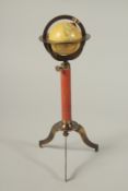A GLOBE ON A STAND. 26cms high.