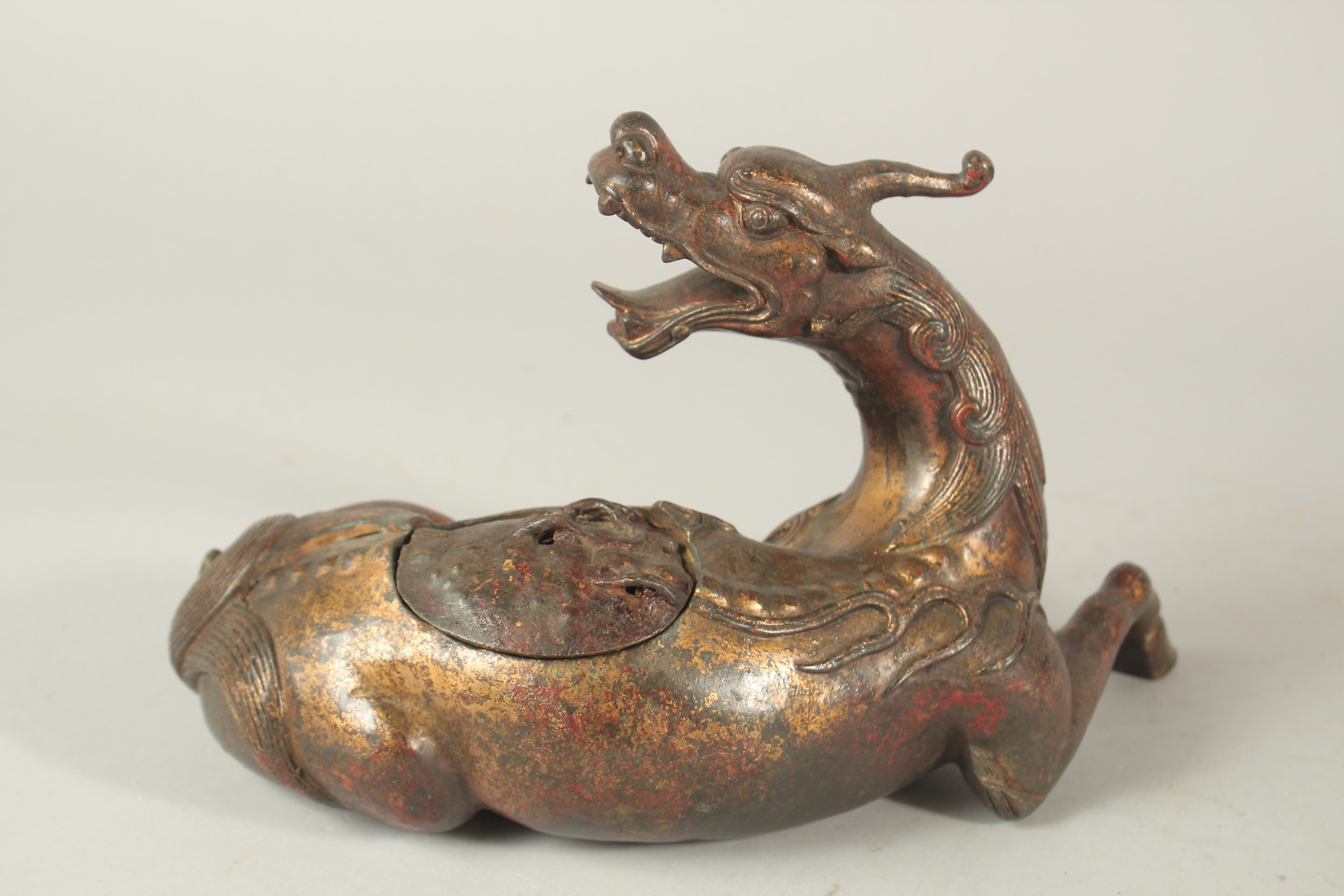 A BRONZE FIGURAL BEAST-FORM CENSER, with traces of gilt and red paint. 27cms long. - Image 2 of 4