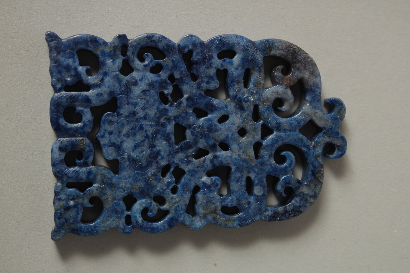A CHINESE PIERCED LAPIS PENDANT. 7cms x 4.5cms.