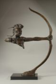 A LARGE ABSTRACT BRONZE INDIAN ARCHER on a marble base. 70cms high.