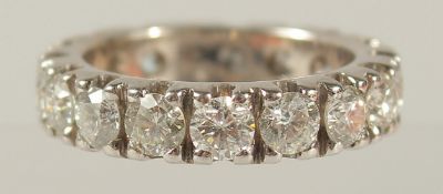 A SUPERB 18CT WHITE GOLD AND DIAMOND ETERNITY RING. 4ct of diamonds.