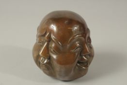 A BRASS BUDDHA FOUR FACED HEAD. 12cms.