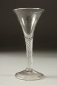 A GEORGIAN WINE GLASS with air twist stem and tapering bowl. 6ins high.