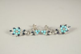 A MATCHING PAIR OF EAR STUDS.