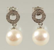 A PAIR OF 9CT WHITE GOLD CULTURED PEARL DROPLET EARRINGS with diamond halos. R/C diamonds 0.15ct,