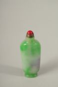 A CHINESE JADE SNUFF BOTTLE AND STOPPER.