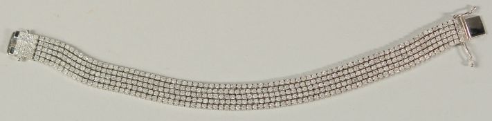 AN 18CT WHITE GOLD RBC DIAMOND FIVE-STRAND BRACELET with open box clasp and double safety catch,