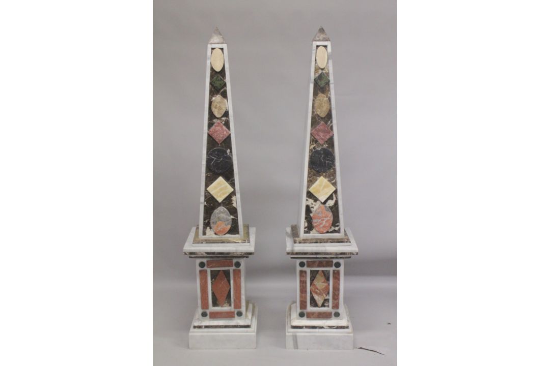 A GOOD PAIR OF COLOURED MARBLE OBELISKS ON STANDS. 6ft high. - Image 1 of 6