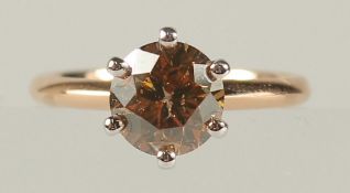AN 18CT ROSE AND WHITE GOLD SIX CLAW SET RBC DIAMOND SOLITAIRE RING, boxed. Fancy orangish brown
