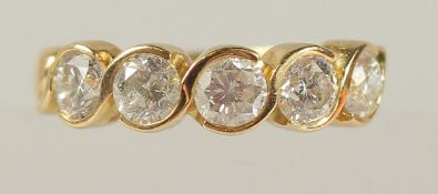 A GOOD 18CT GOLD FIVE-STONE DIAMOND HALF HOOP RING.