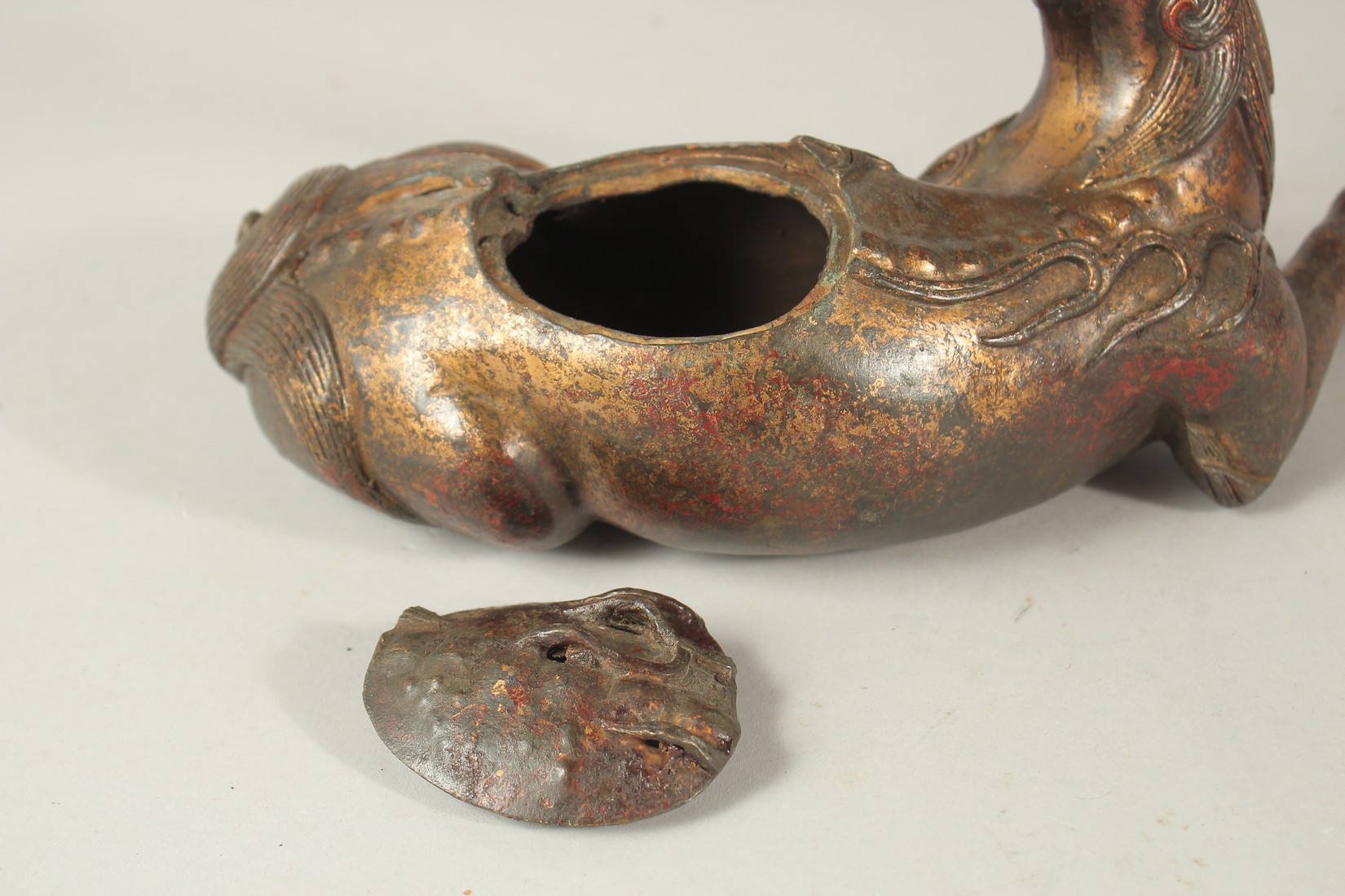A BRONZE FIGURAL BEAST-FORM CENSER, with traces of gilt and red paint. 27cms long. - Image 3 of 4