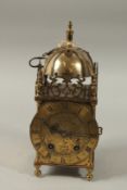 A GOOD BRASS LANTERN CLOCK by F. H. PRATT, DERBY. 13ins high.