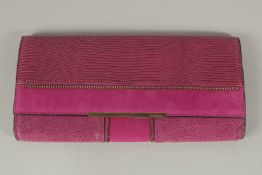 A VINCE CAMUTO MAROON BAG. 33cms long x 16cms deep.