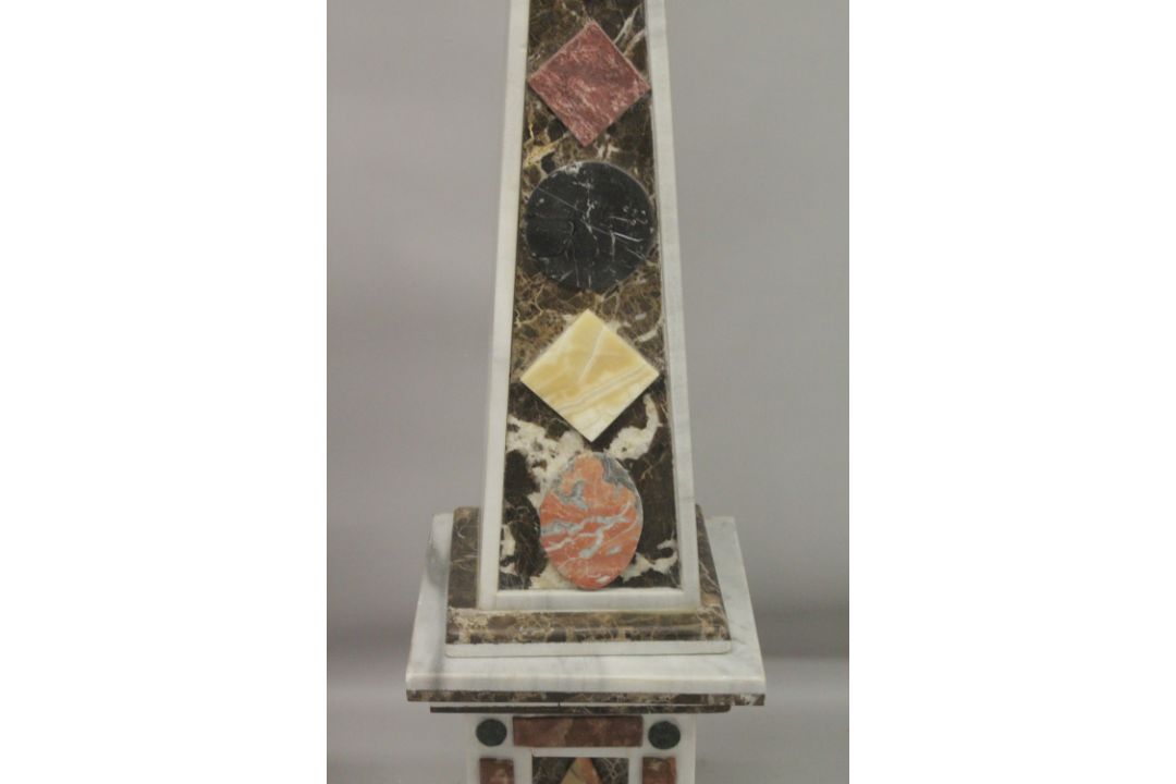 A GOOD PAIR OF COLOURED MARBLE OBELISKS ON STANDS. 6ft high. - Image 5 of 6