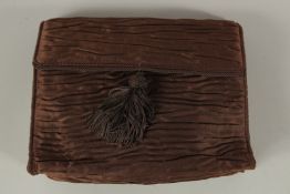 A PRADA, ITALY, BLACK SILK BAG with silk interior and tassle. 20cms long x 17cms deep.