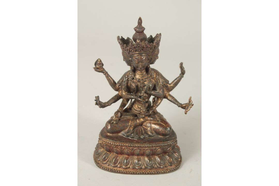 A BRONZE FIGURE OF A MULTI-ARMED DEITY. 17cms high. - Image 1 of 3