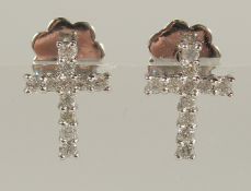 A PAIR OF 9CT WHITE GOLD DIAMOND CROSS SCREW-BACK EARRINGS, boxed. R/C diamonds 0.26ct.