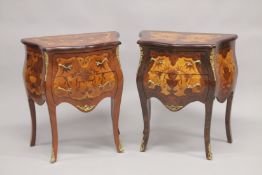 A PAIR OF LOUIS XVITH DESIGN INLAID BOMBE FRONTED COMMODES, each with two drawers, on curving