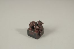 A MINIATURE SQUARE BRONZE CAMEL SEAL. 2cms.