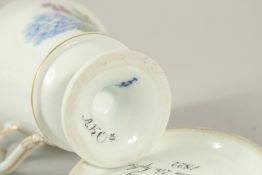 A MEISSEN DOCUMENTARY CUP AND SAUCER trialling a new blue colour. The formula AKO in script to the