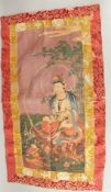 A TIBETAN THANGKA on silk.