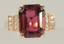 AN 18CT ROSE GOLD PINK TOURMALINE AND RBC DIAMOND RING. Pink tourmaline 6.42ct. Diamonds 0.21ct.