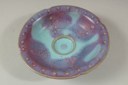A CHINESE PURPLE PORCELAIN CIRCULAR SPLASH BOWL. 6.5cms diameter.