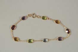 AN 18CT YELLOW GOLD MULTI-COLOUR GEM STONE BRACELET.