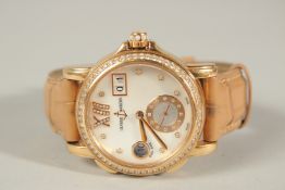 A SUPERB ULYSSE NARDIN 18CT ROSE GOLD WRISTWATCH with mother-of-pearl face, diamond surround, date