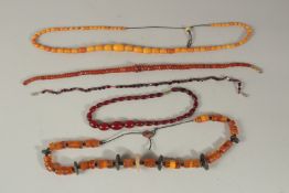 A COLLECTION OF AMBER AND AMBER-TYPE BEADED NECKLACES, (qty).