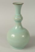 A CHINESE CELADON GLAZE BOTTLE VASE, 29cm high.