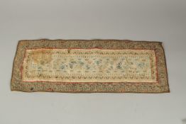 A CHINESE EMBROIDERED SILK PANEL.