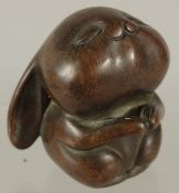 A BRONZE OKIMONO OF A STYLISED RABBIT, 6cm high.