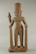 A LARGE KHMER CARVED SANDSTONE FIGURE, 80cm high.