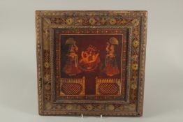 A FINE 19TH CENTURY SOUTH INDIAN TANJORE PAINTING OF SEATED GANESH, with a border of reverse-glass