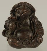 A BRONZE OKIMONO OF AN ANTHROPOMORPHIC FROG, 5.5cm high.