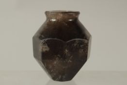 AN ISLAMIC CARVED ROCK CRYSTAL BOTTLE, 6cm high.