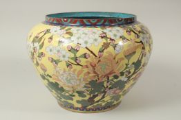 A LARGE CHINESE YELLOW GROUND CLOISONNE JARDINIERE, with floral decoration, the interior and base