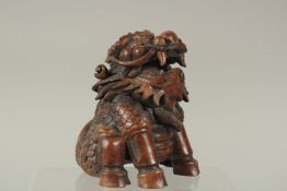A CHINESE CARVED BAMBOO FIGURE OF A MYTHICAL BEAST, 14.5cm high.