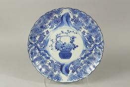 A LARGE JAPANESE MEIJI ERA ARITA BLUE AND WHITE PORCELAIN CHARGER with scalloped rim, 40cm