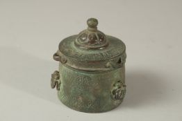 A RARE 12-13TH CENTURY PERSIAN SELJUK KHURASAN BRONZE INKWEL WITH KUFIC CALLIGRAPHY, 7.5cm high.