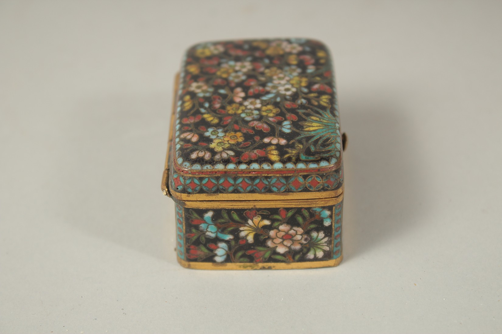 A FINE JAPANESE MEIJI PERIOD BLACK GROUND CLOISONNE BOX, with floral decoration and hinged lid, 5. - Image 5 of 8