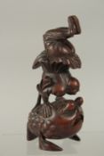 A FINE CHINESE CARVED BAMBOO FIGURE OF AN ACROBAT UPON A LARGE TOAD, 19cm high.