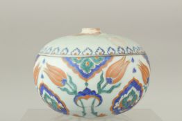 A TURKISH OTTOMAN IZNIK DESIGN HANGING BALL, 17cm wide.