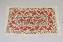 A 20TH CENTURY CENTRAL ASIAN SUZANI EMBROIDERED TEXTILE.