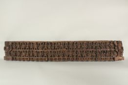A LARGE AND FINLEY CARVED 19TH CENTURY INDIAN WOODEN PANEL, carved with multiple figures, 120cm x