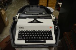 An Olympia portable electric typewriter.