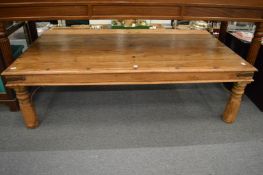 A large hardwood coffee table.