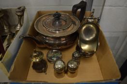 A plated teapot and other items.