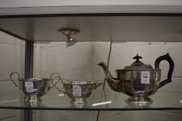 A silver three piece tea service.